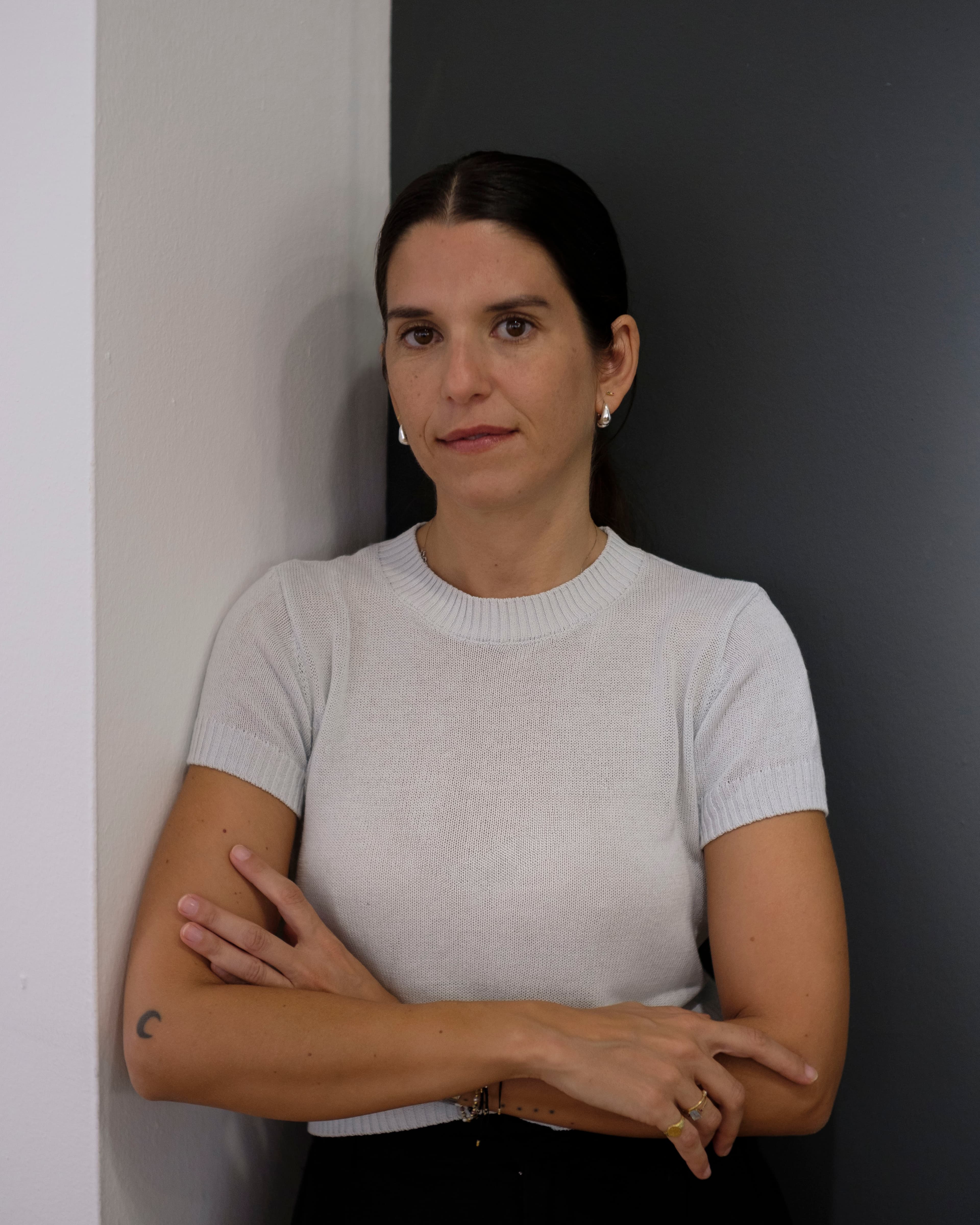 Cristina García Correro, founder of Gaico Studio, photographed against a neutral grey wall
